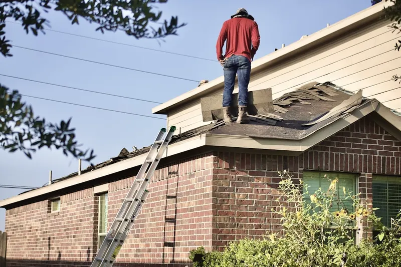 Professional roofer working on a residential roof in Fortuna Foothills